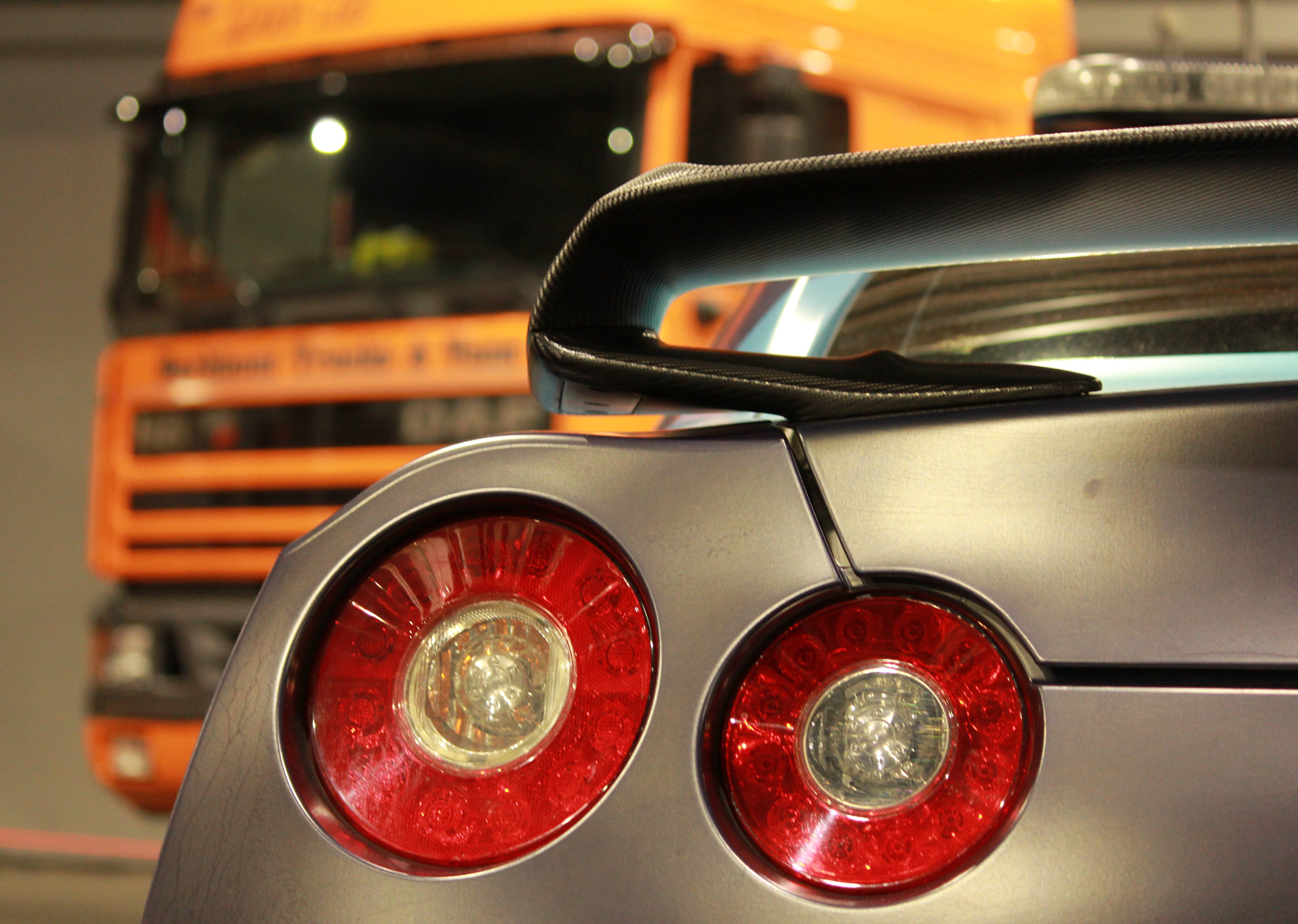Nissan GTR taillight with blurred truck